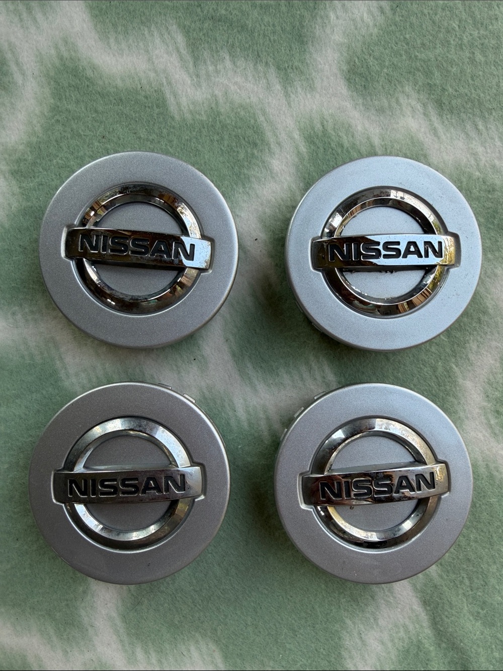 Nissan Silver Chrome Wheel Center Caps Set of 4 - part 40342 - EA210